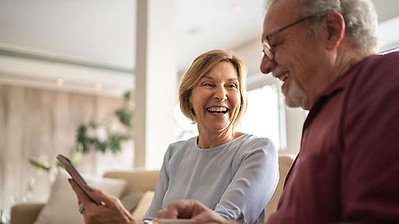 Smiling elderly couple