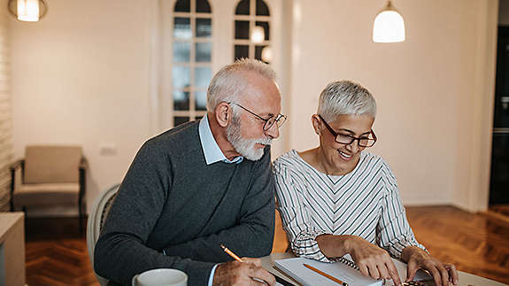 Older couple working on numbers