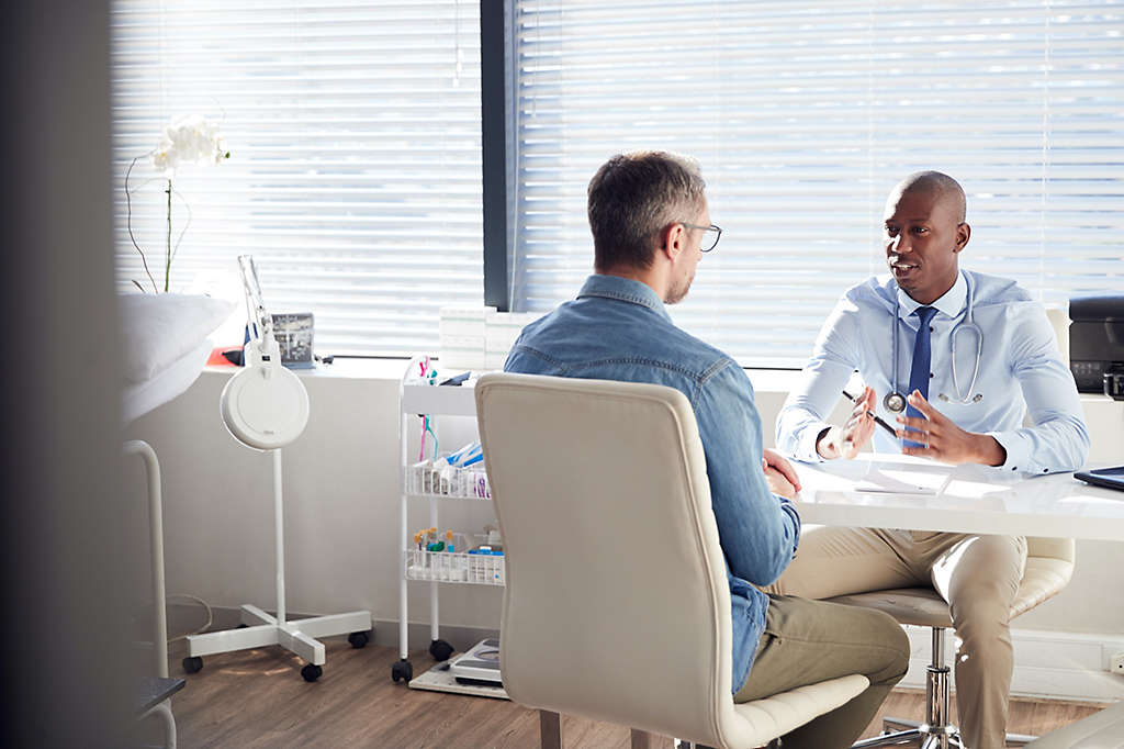 Man talking with doctor