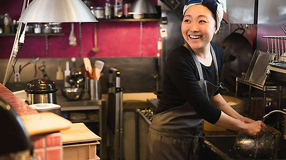 Small business owner working in her kitchen