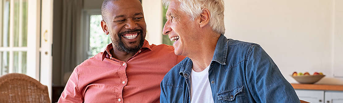 Two men laughing together