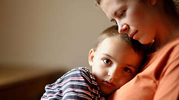 Child laying on his mother