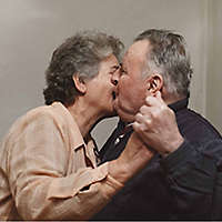 An elderly couple embracing, knowing their future is secure. 