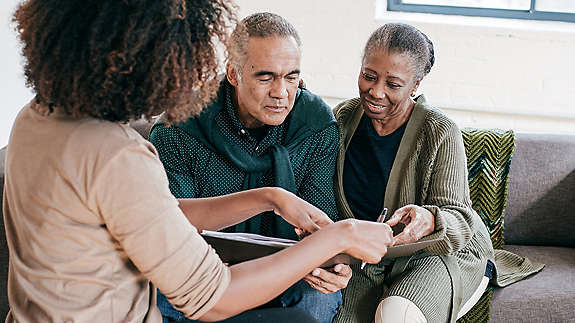 Agent meeting with older couple 