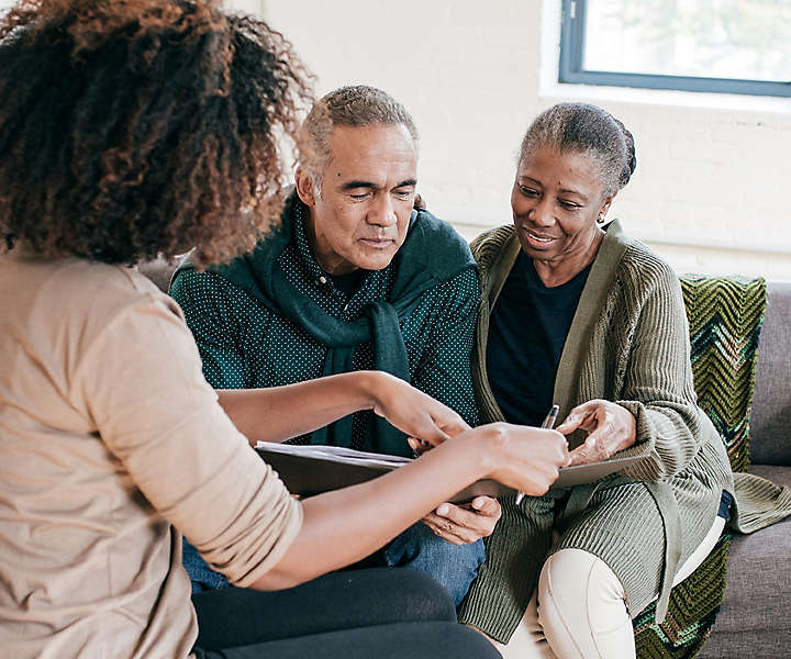 https://assets.newyorklife.com/is/image/newyorklife/banner-story-iStock-1053736232-agent-meeting-with-older-couple-w720-h600