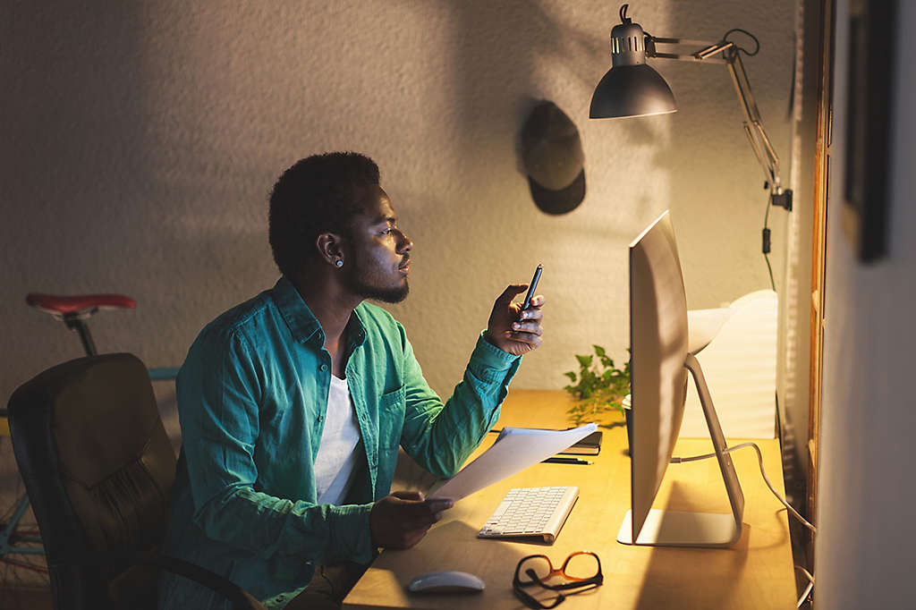 Black Businessman Using Mobile Phone