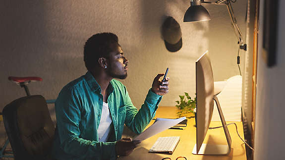 Black Businessman Using Mobile Phone