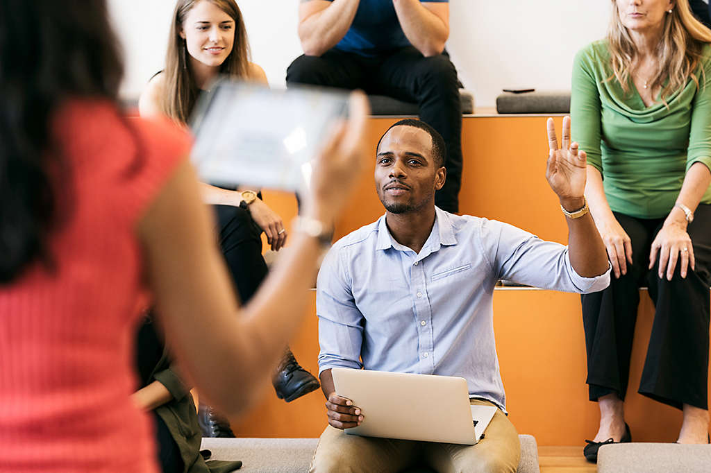 Man raising hand presentation