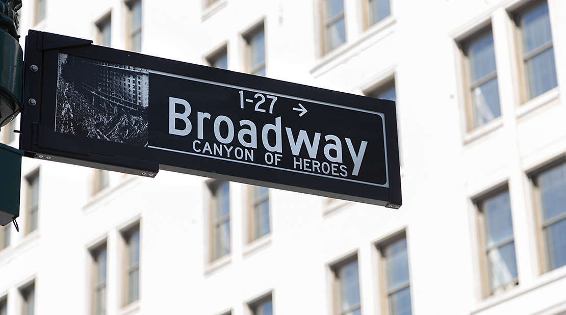 A Broadway street sign showing canyon of heroes
