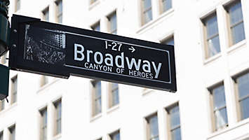 A Broadway street sign showing canyon of heroes