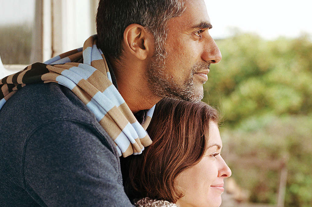 Contemplative loving couple staring off into the distance