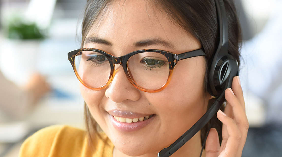 Young woman using a headset