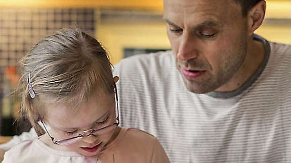 Dad and daughter doing art work