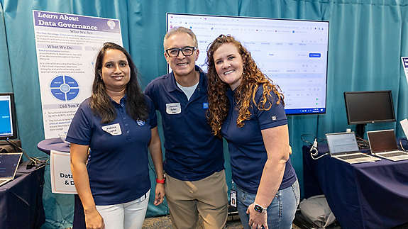 AI and Data booth hosts Ankita Gupta, Dennis Suler, and Jessica Branch.