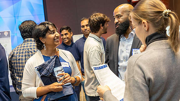 Madhu Yedlapati from the Field Productivity Value Stream, Elliott White from Corporate Finance, and Iryna Nazirbaeva from Corporate Compliance.