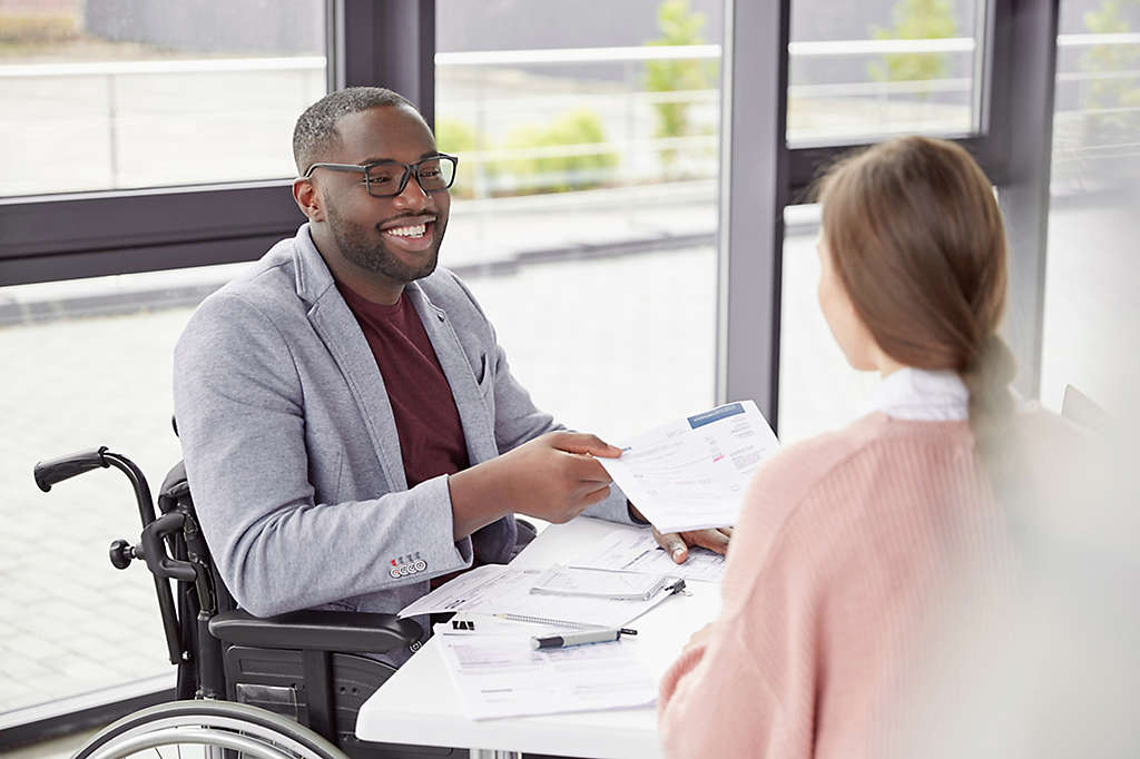  Person in a wheelchair in a meeting at work