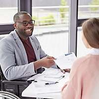  Person in a wheelchair in a meeting at work