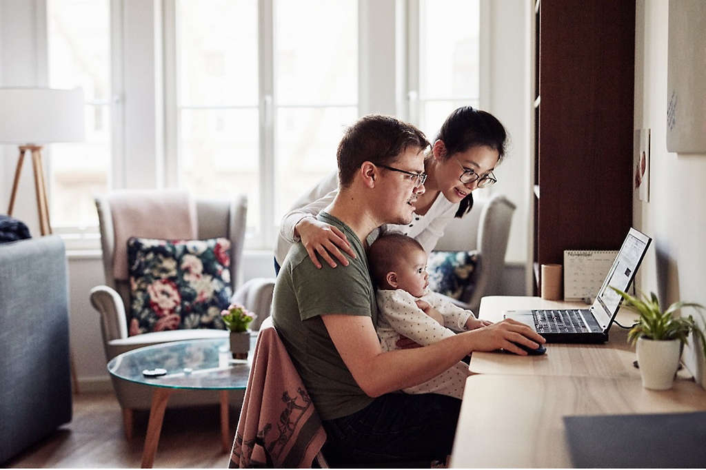 Family with young child researching investment diversification