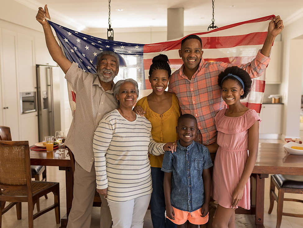 family-holding-american-flag.jpg