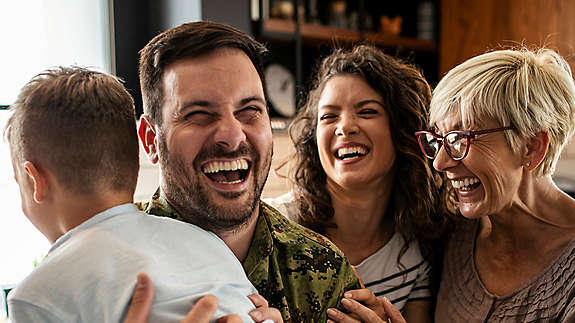 2000x2000px-iStock-1176609956-family-with-veteran-smiling.jpg