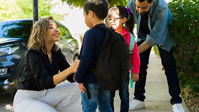 Parents taking their kids to school