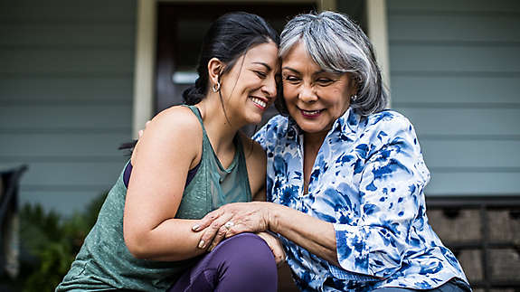 Mother and daughter embracing 