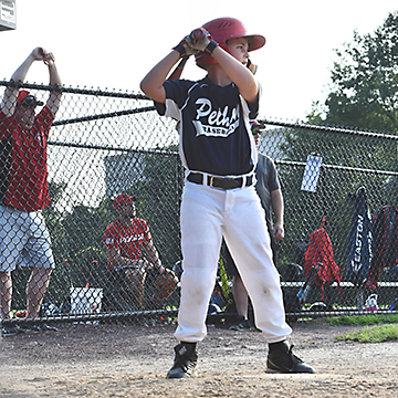 A young kid playing baseball