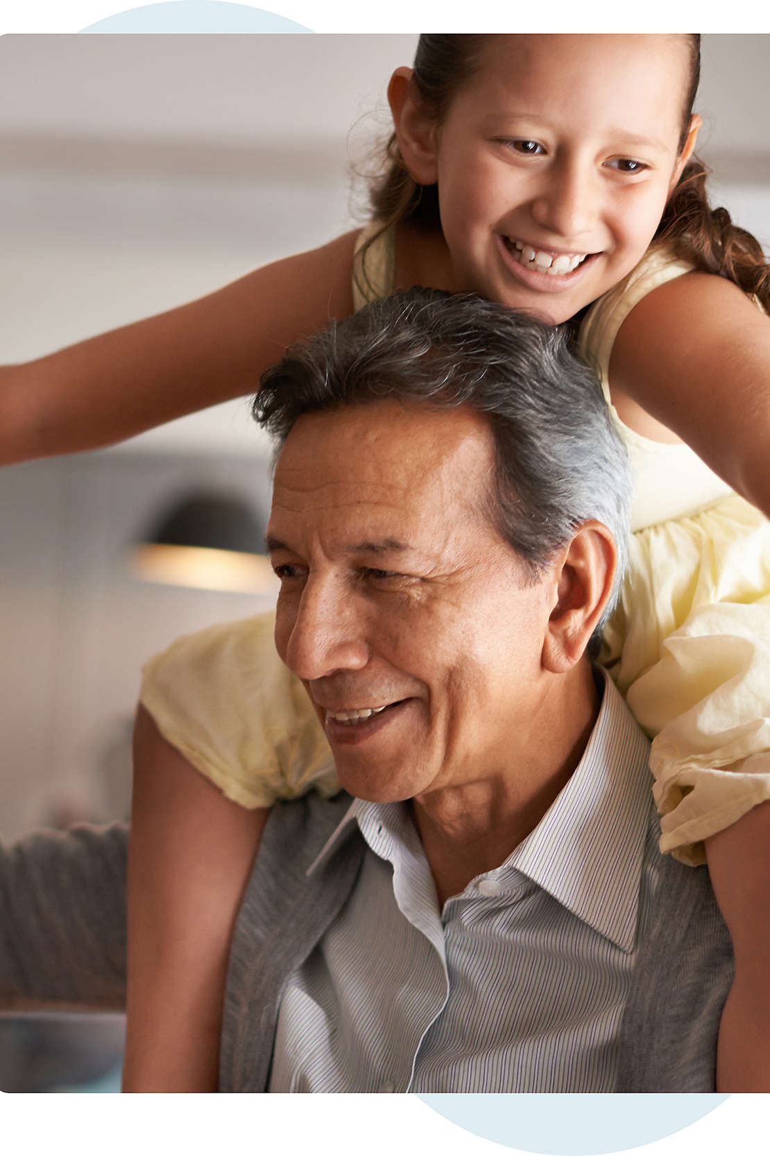 Granddaughter on grandfathers shoulders