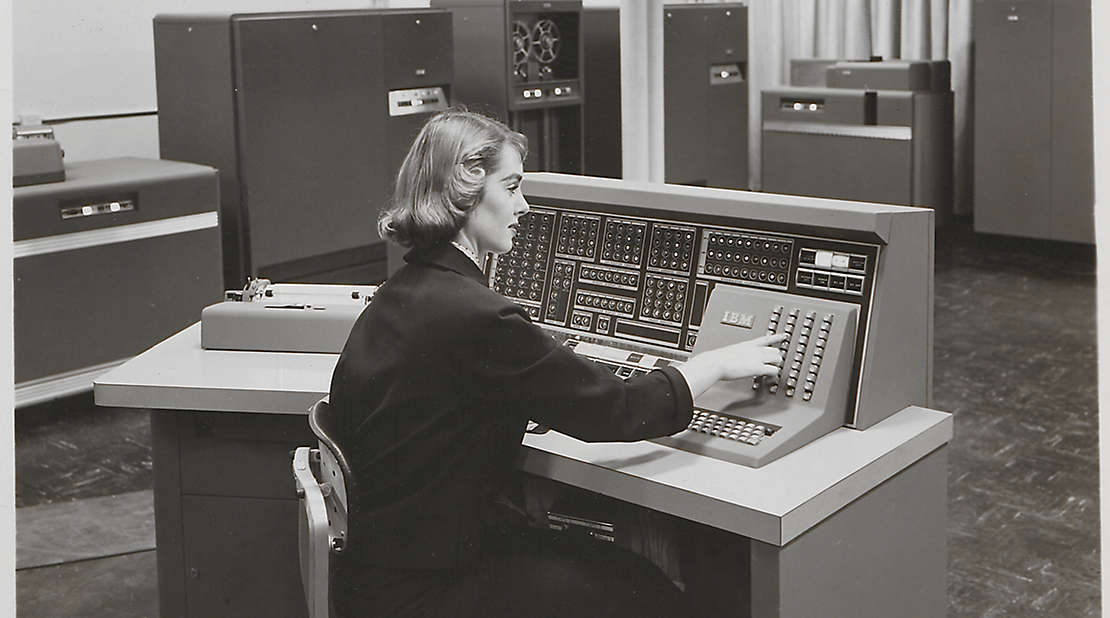 women using vintage computer