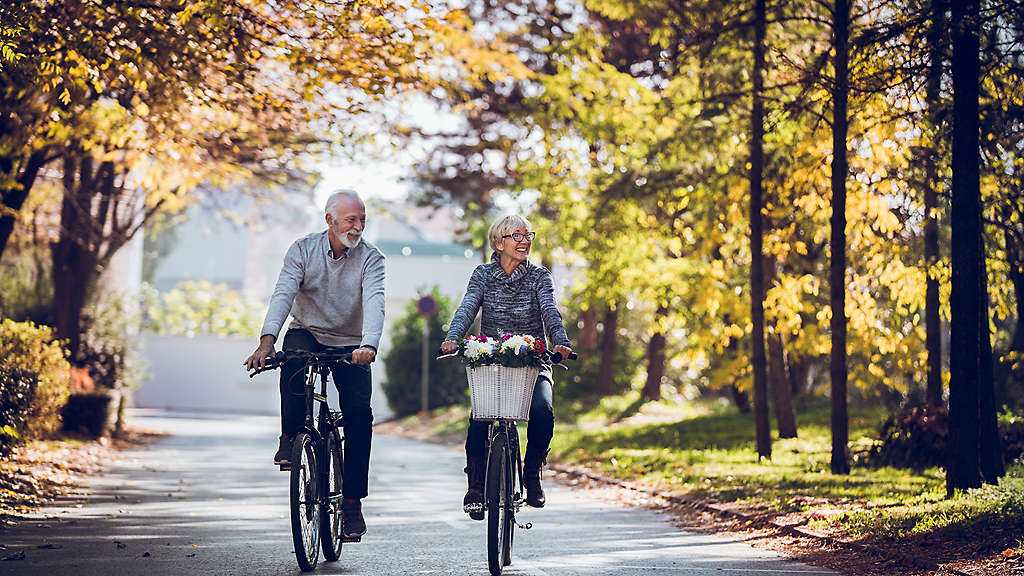 Senior couple riding bikes.
