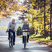 Senior couple riding bikes.