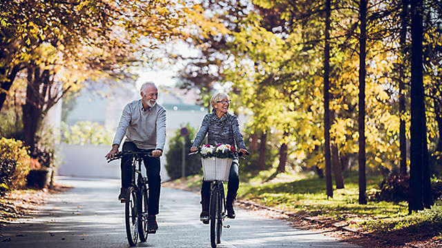 Senior couple riding bikes.