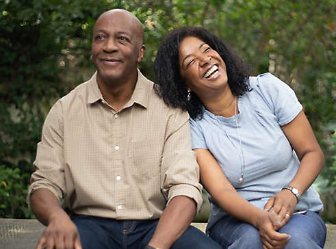 Couple smiling in park