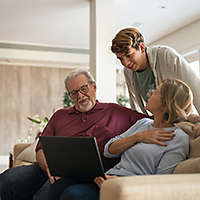Grandparents talking to grandchild in livingroom