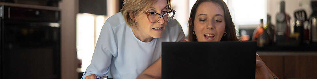 Grandparent helping grandchild with work or homework.