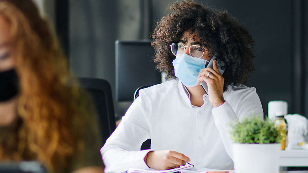 Women on conference call in cafe