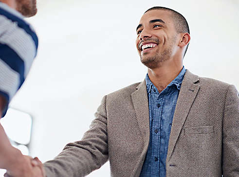 Person shaking hands and smiling