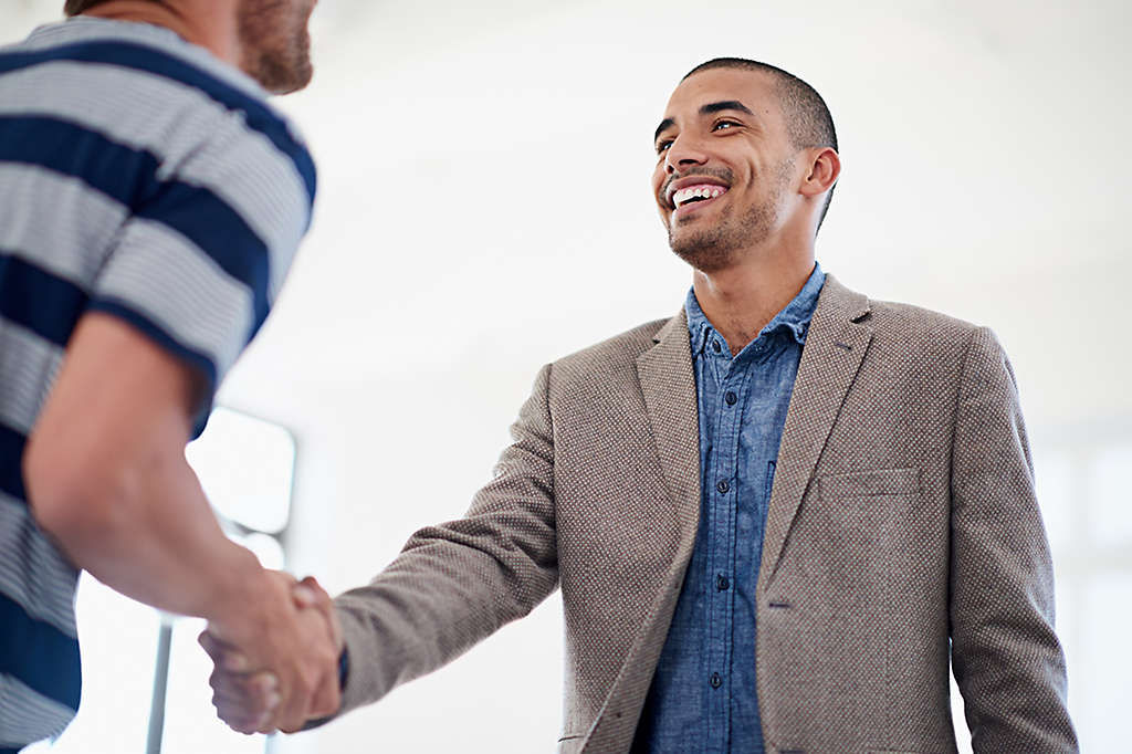 Two men shaking hands.