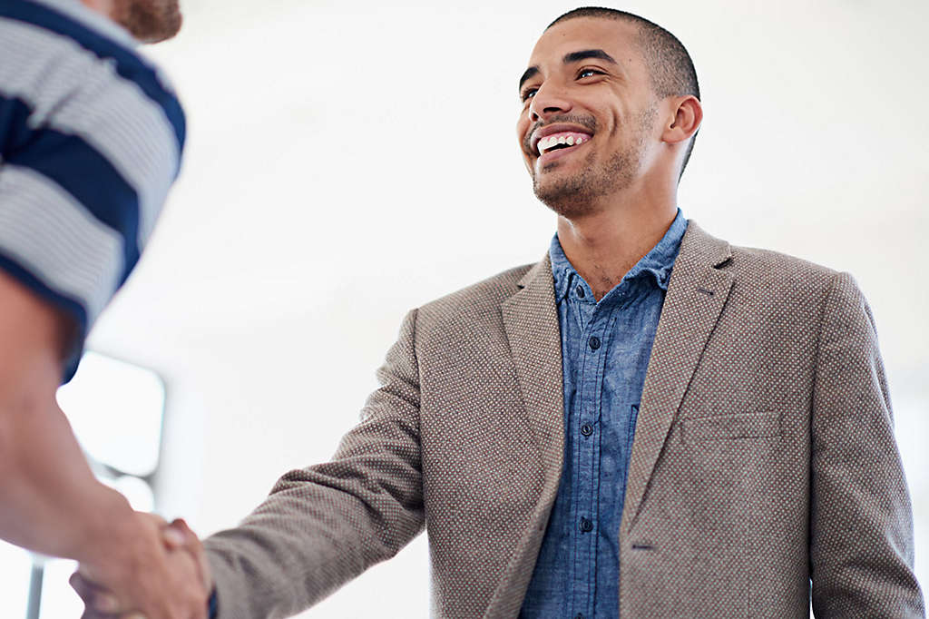 Two men shaking hands.