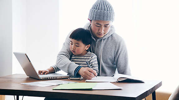 Person working with child.