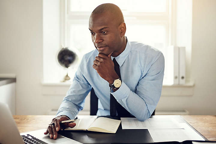  Person working in his office on a laptop