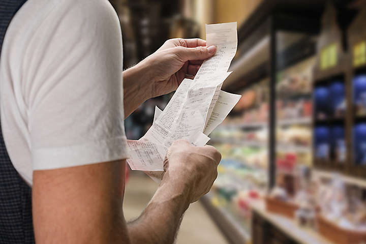 person holding receipts