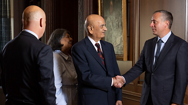 Jaydev Patel shaking hands with Craig DeSanto