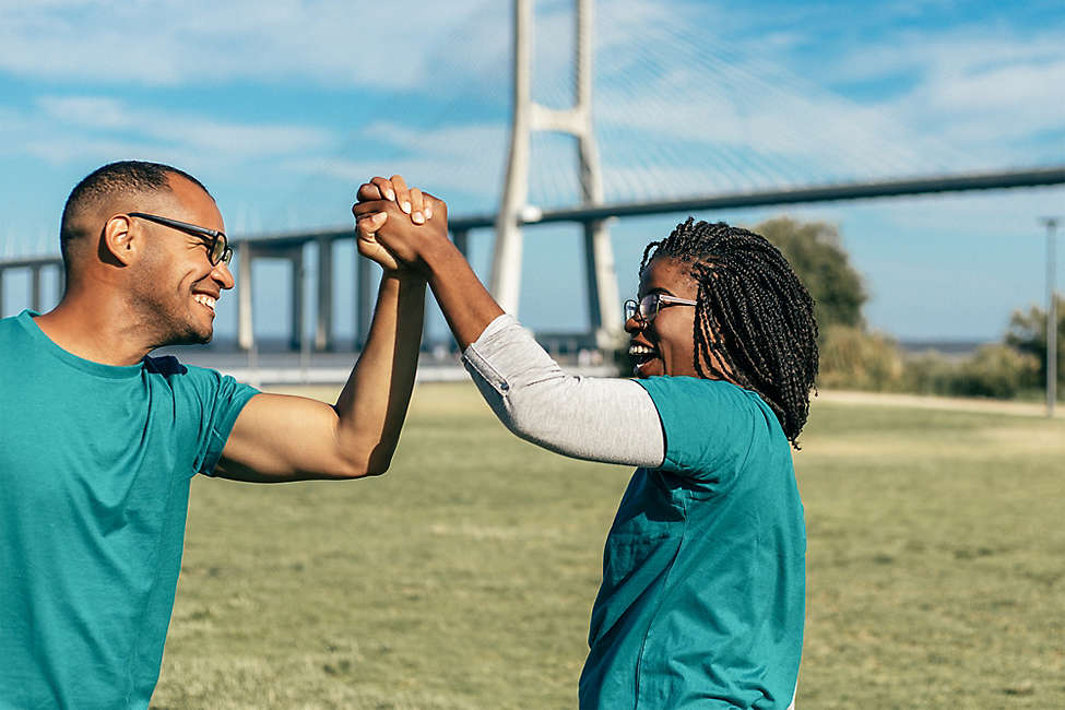 Man and woman high fiving