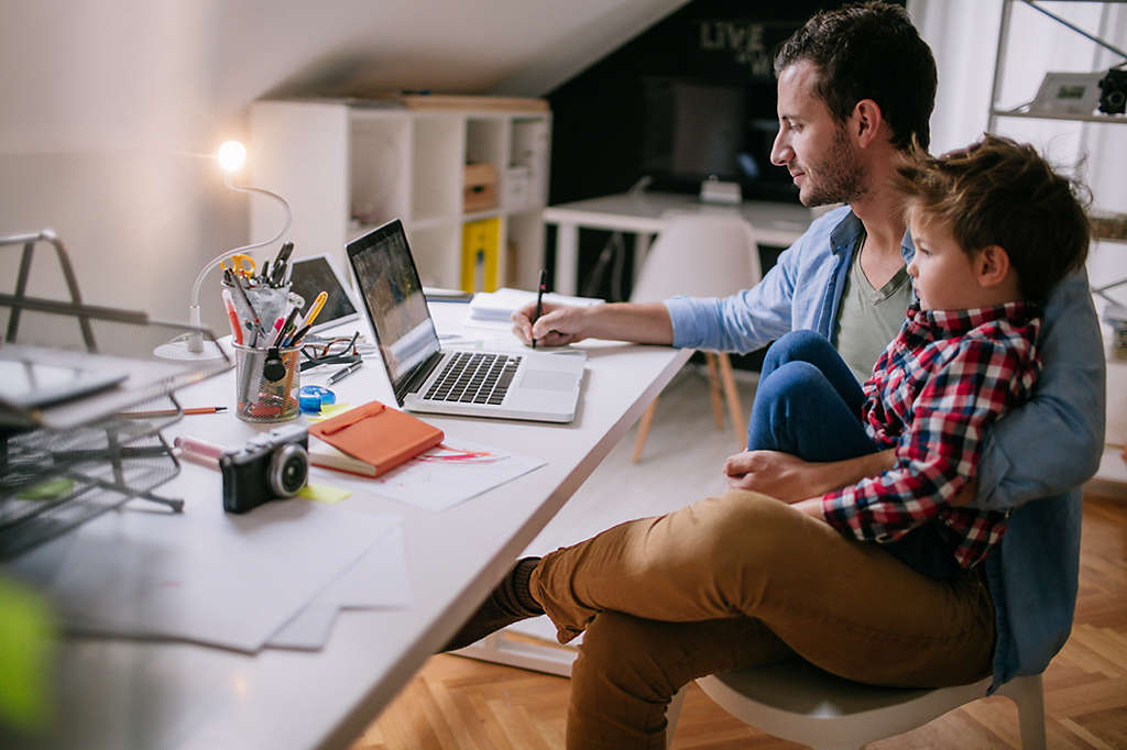 Person sitting at desk working with their CFP certified financial planner