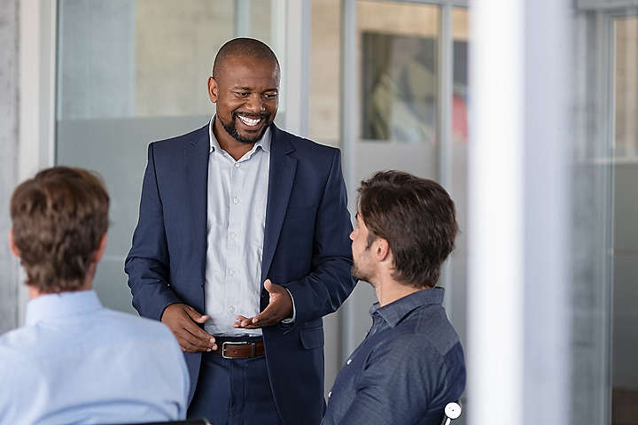 Group of business people having a conversation