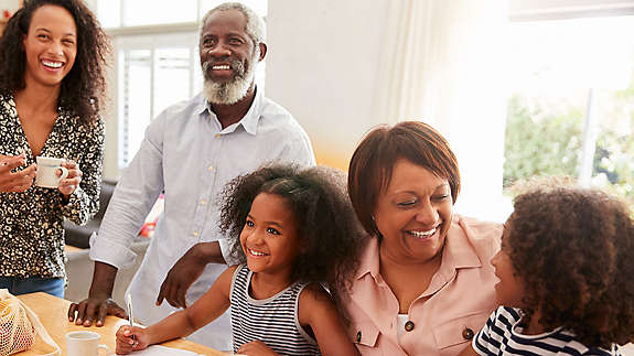 Family together in their kitchen