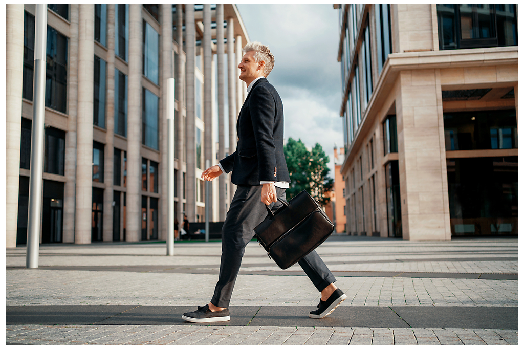 A man walking with a briefcase