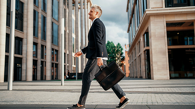 A man walking with a briefcase