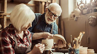 Older couple enjoying pottery